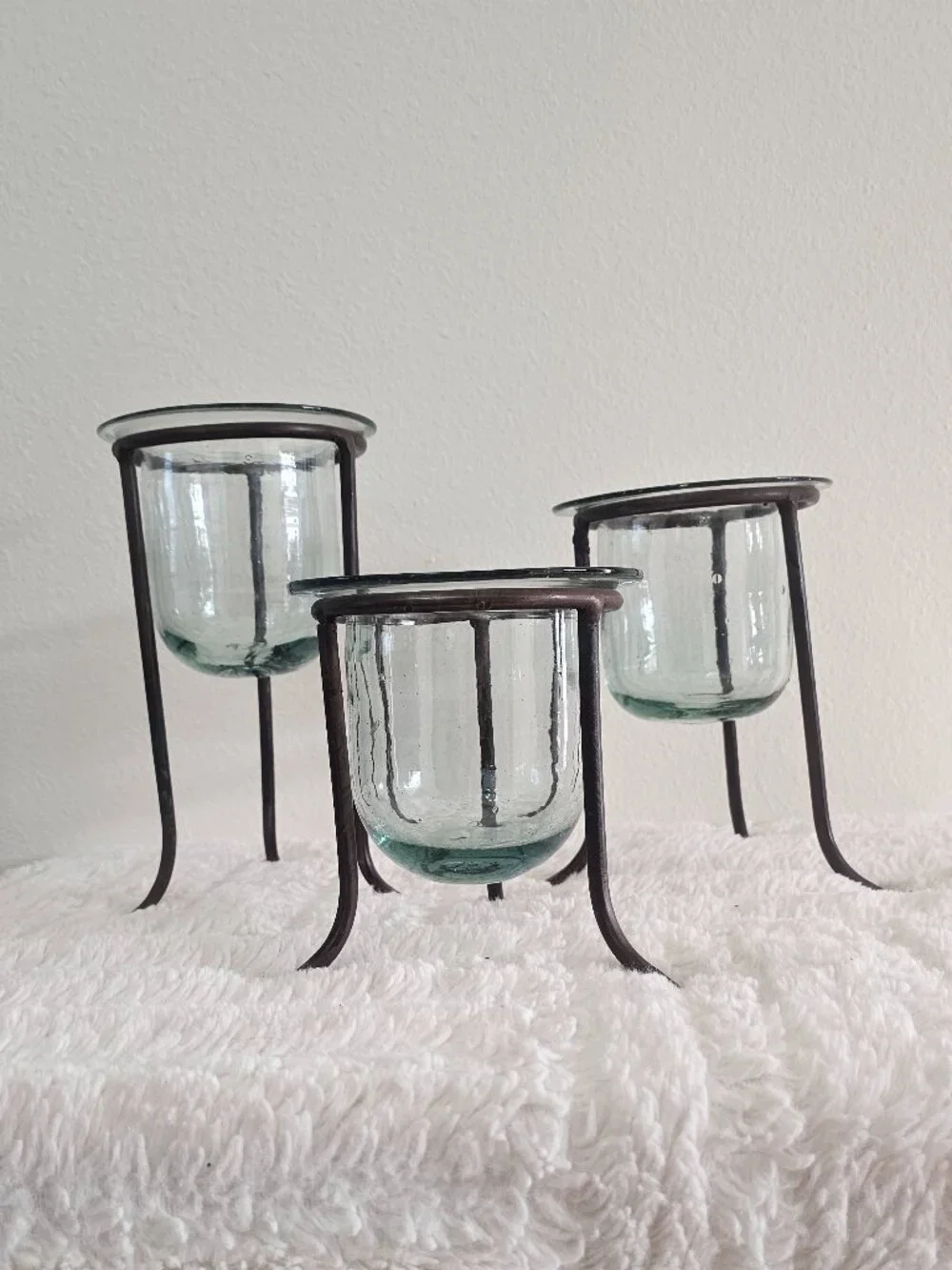 Wrought iron and hand-blown glass candle holders